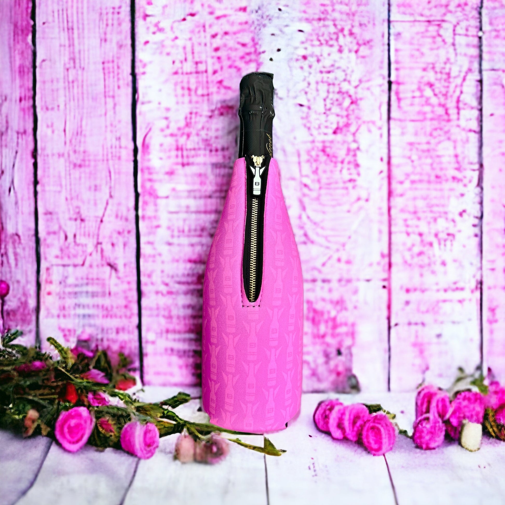 Pink zippered neoprene champagne bottle insulator sleeve featuring a repeating Bomber pattern for 750mL bottles.⁠