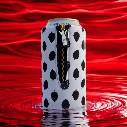Bomber 12oz white and black hop leaf pattern zippered 4mm neoprene can insulator with heavy-duty zipper set against a red water ripple background.